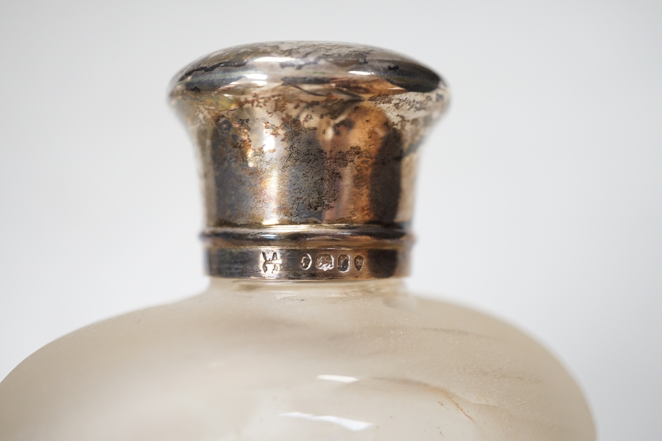 A Victorian silver mounted glass pocket flask, with crested cup base, London 1872, retailed by Asprey & Co., height 17.5cm
